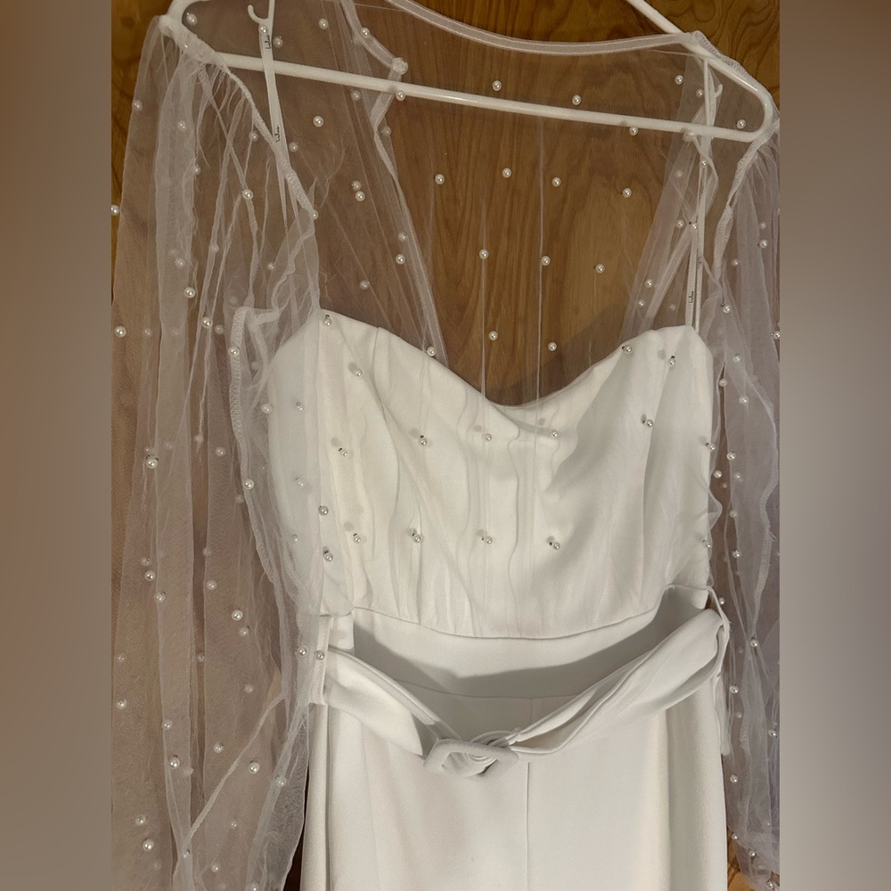 Lulu’s white pant suit with sheer, beaded top. 
Size M